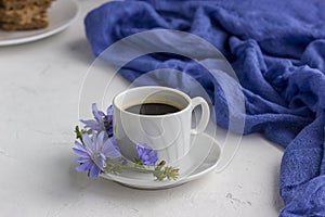 Diet drink chicory in a cup, coffee substitute. Cichorium intybus flower