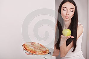 Diet And Fast Food Concept. Overweight Woman Standing On Weighing Scale Holding Pizza. Unhealthy Junk Food. Dieting, Lifestyle. W