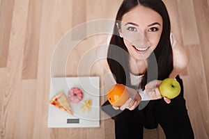 Diet And Fast Food Concept. Overweight Woman Standing On Weighing Scale Holding Pizza. Unhealthy Junk Food. Dieting, Lifestyle. W