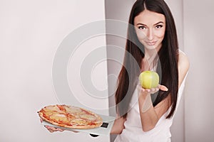 Diet And Fast Food Concept. Overweight Woman Standing On Weighing Scale Holding Pizza. Unhealthy Junk Food. Dieting, Lifestyle. W