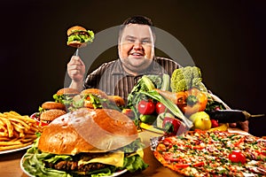 Diet fat man makes choice between healthy and unhealthy food.