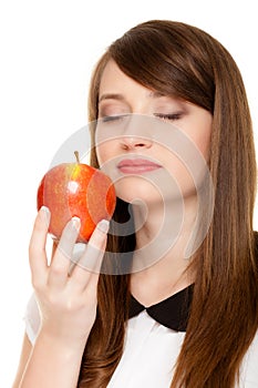 Diet. Girl smelling apple seasonal fruit.