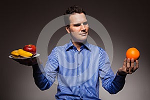 Diet health care healthy nutrition, young man with fruits