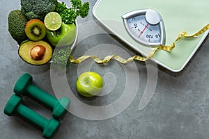 Diet and Healthy life Concept. Green apple and Weight scale measure tap with fresh vegetable