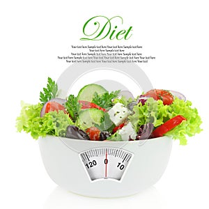 Vegetables salad in a bowl with weight scale photo