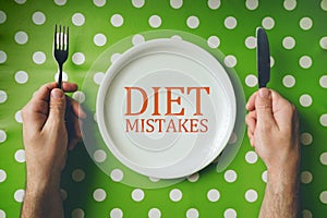 Diet mistakes concept, top view of dinning table photo