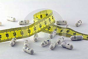 Diet pills and a tape measure