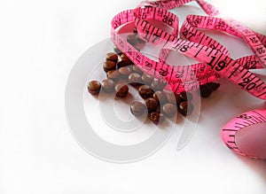 Diet pills and a tape measure. Weight loss ayurvedic treatment.