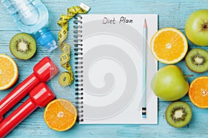 Diet plan, menu or program, tape measure, water, dumbbells and diet food of fresh fruits on blue background, detox concept