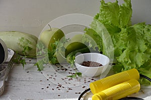Diet plan, menu or program, tape measure, water and diet food, weight loss and detox concept, top view, green vegetables