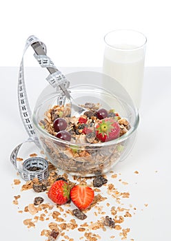 Diet weight loss concept. Muesli cereals tape measure