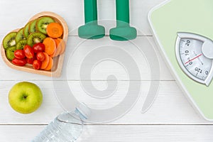 Diet and weight loss for healthy care with weight scale and fitness equipment,fresh water and fruit healthy,