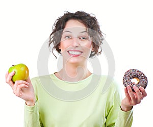 Diet. Woman choosing between Fruit and Donut