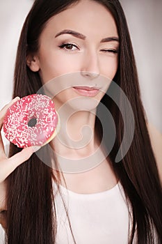 Diet. Woman Measuring Body Weight On Weighing Scale Holding Donut and apple. Sweets Are Unhealthy Junk Food. Dieting, Healthy Eat