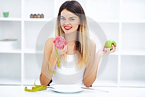 Diet. Young beautiful woman eating burger, It`s junk and unhealt