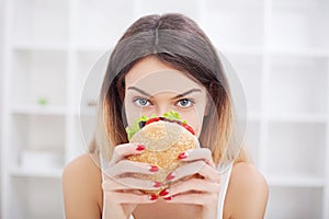 Diet. Young woman with duct tape over her mouth, preventing her