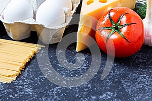 Dietary balance picture with fruits and vegetables on black stone background