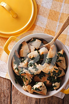 Dietary food: Chicken breast braised with spinach in a saucepan.