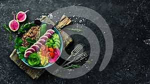 Dietary food: Quinoa, watermelon radish, cucumber, tomatoes and spinach. Bowl Buddha. Vegan food.