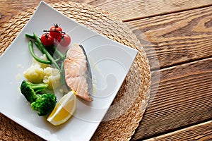 Dietary food. Salmon steak with vegetables.