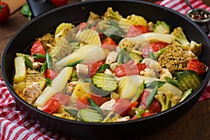 Dietary menu. Steamed vegetables with chicken fillet in pan.