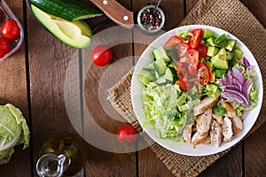 Dietary salad with chicken, avocado, cucumber, tomato and Chinese cabbage.