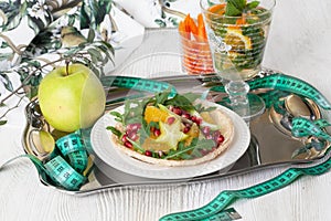 Dietary salad with orange, pomegranate and carom, centimeter for a good figure