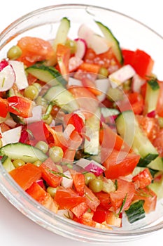 Dietary salad from tomatoes, cucumbers and radish