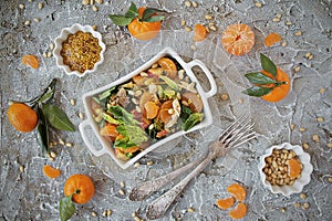 Dietary spinach salad and Mandarin oranges with dressing of mustard and pine nuts