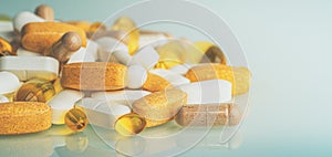 Dietary Supplements macro photo: multivitamin tablets, softgels with Omega-3 and Vitamin D3, antioxidants and capsules