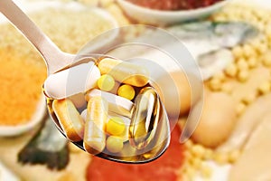 Dietary supplements on protein food background photo