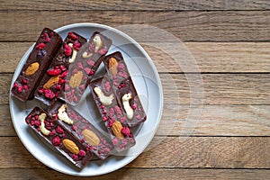 Dietary tea treat for vegan or raw foodists. Healthy homemade recipe chocolate sticks with almonds, cashews and