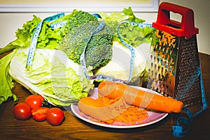 Dietetic foods and vegetables on the centimeter.. photo