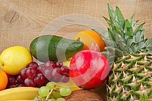 Dietetic set of paleo diet of fruits on wooden plank