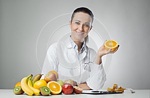 Dietician holding an orange photo