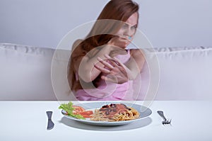 Dieting girl can't eat dinner