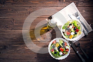 Dieting healthy salad on rustic wooden table top view