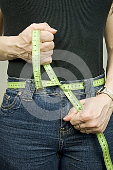 Dieting, tape measure as belt