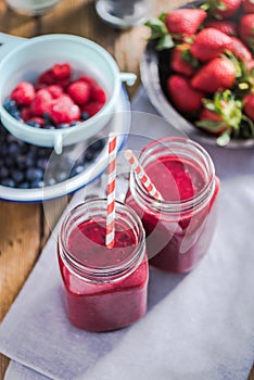 Dieting and well being concept, berry smoothie in jar