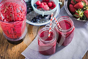 Dieting and well being concept, berry smoothie in jar