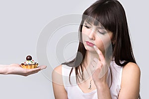 Dieting woman is offered cake