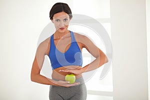 Dieting young woman standing with vitality