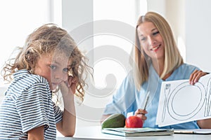 Dietitian explaining the basics of healthy nutrition to a young boy