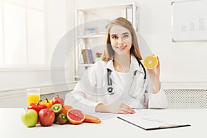 Dietitian nutritionist with fresh orange