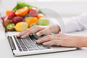 Dietitian typing treatment to patient via internet