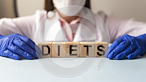 Diets word in doctor hands, dieting concept