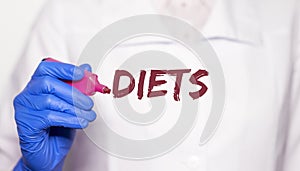 Diets word in doctor hands, dieting concept