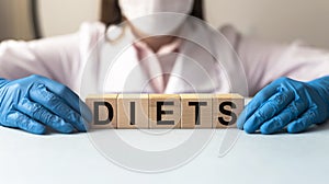 Diets word in doctor hands, dieting concept