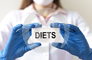 Diets word in doctor hands, dieting concept