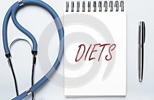 Diets word in doctor hands, dieting concept